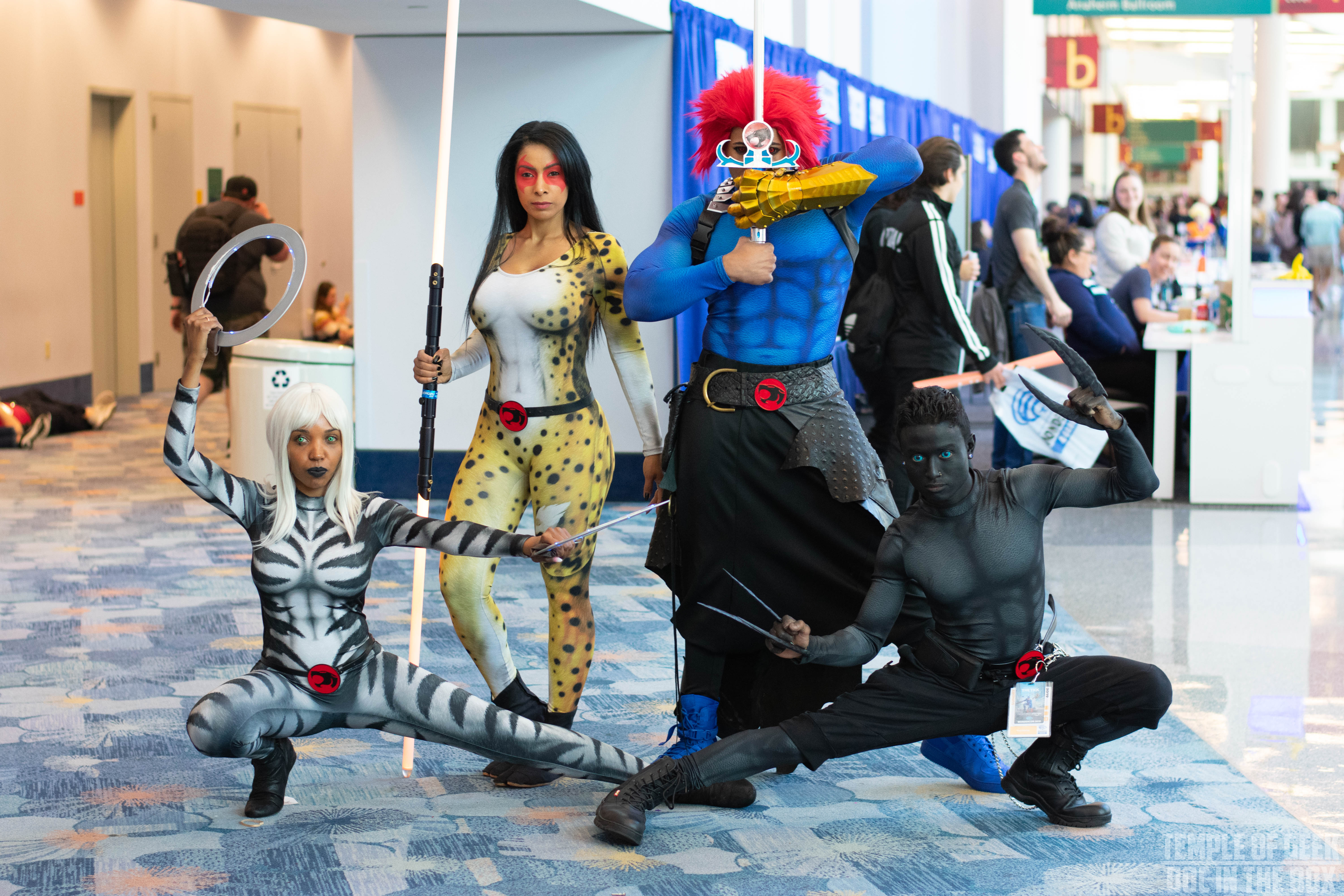 4 Thundercats Cosplayers at Wondercon 2019 pose for a group photo. These cosplayers are all dressed as different characters from the Thundercats fandom. 