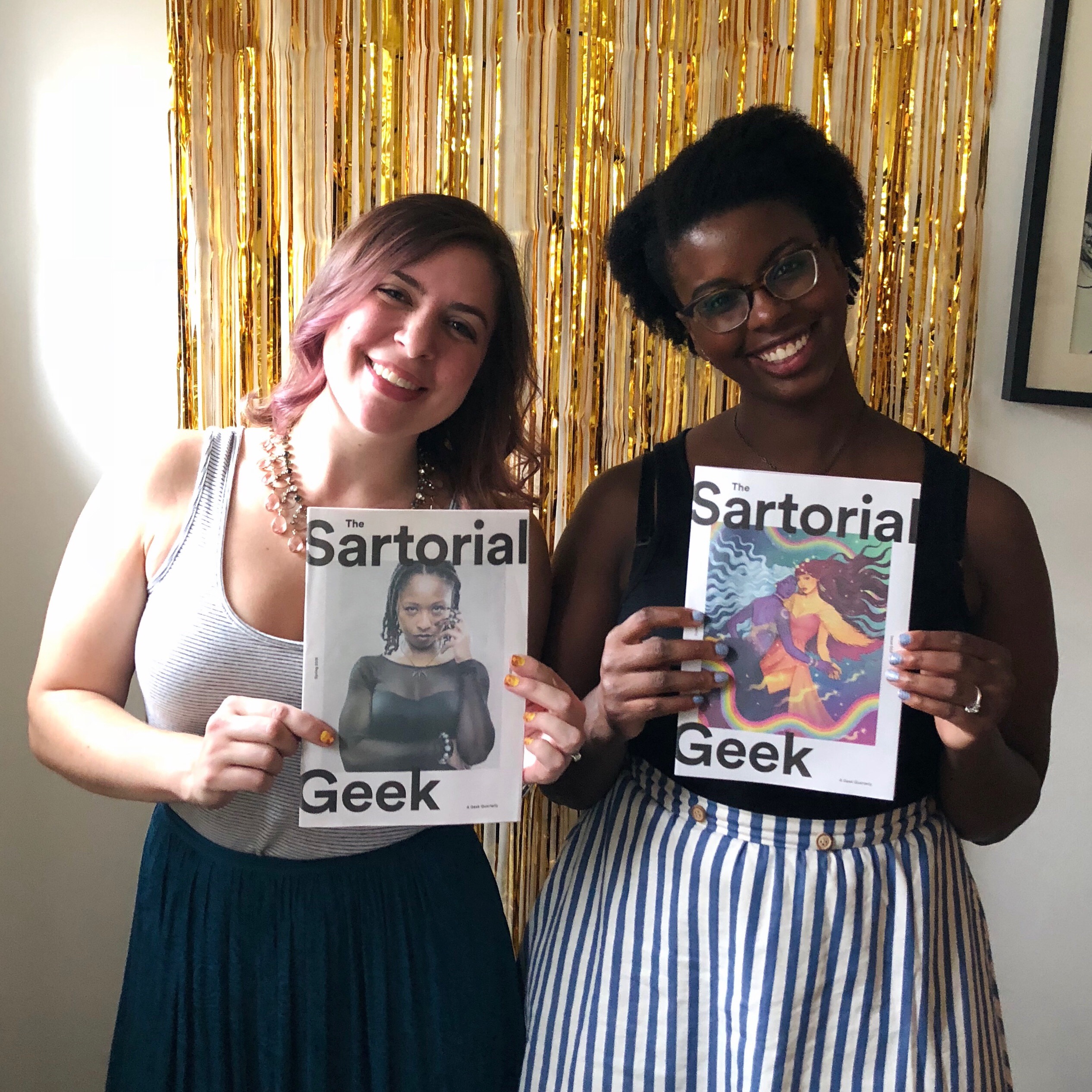 Jordan Ellis and Liz Crowder pose for a photo while holding up copies of The Sartorial Geek magazines