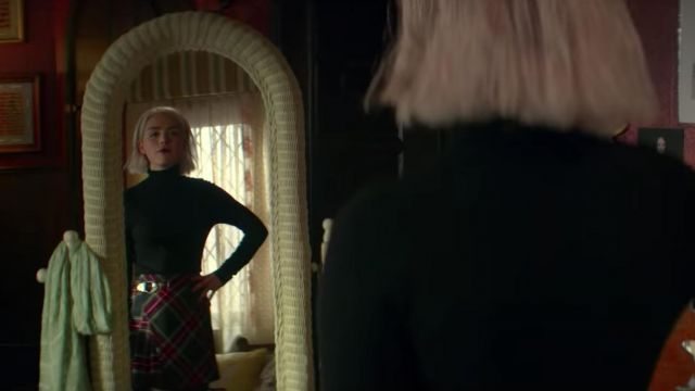 sabrina spellman looking into the mirror checking her look