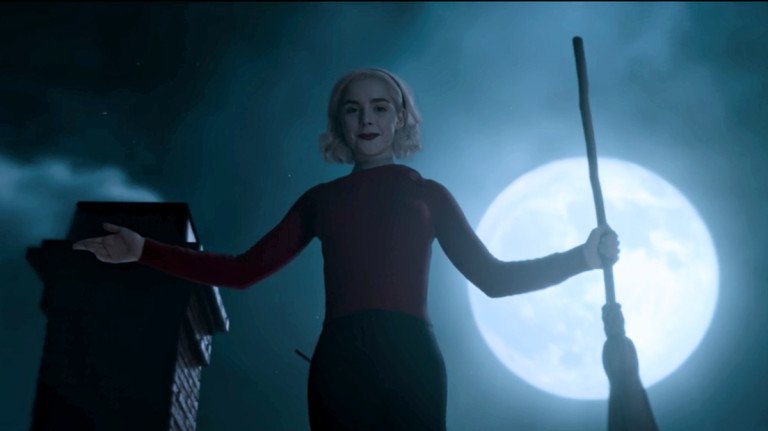 sabrina spellman on roof with broomstick moonlight