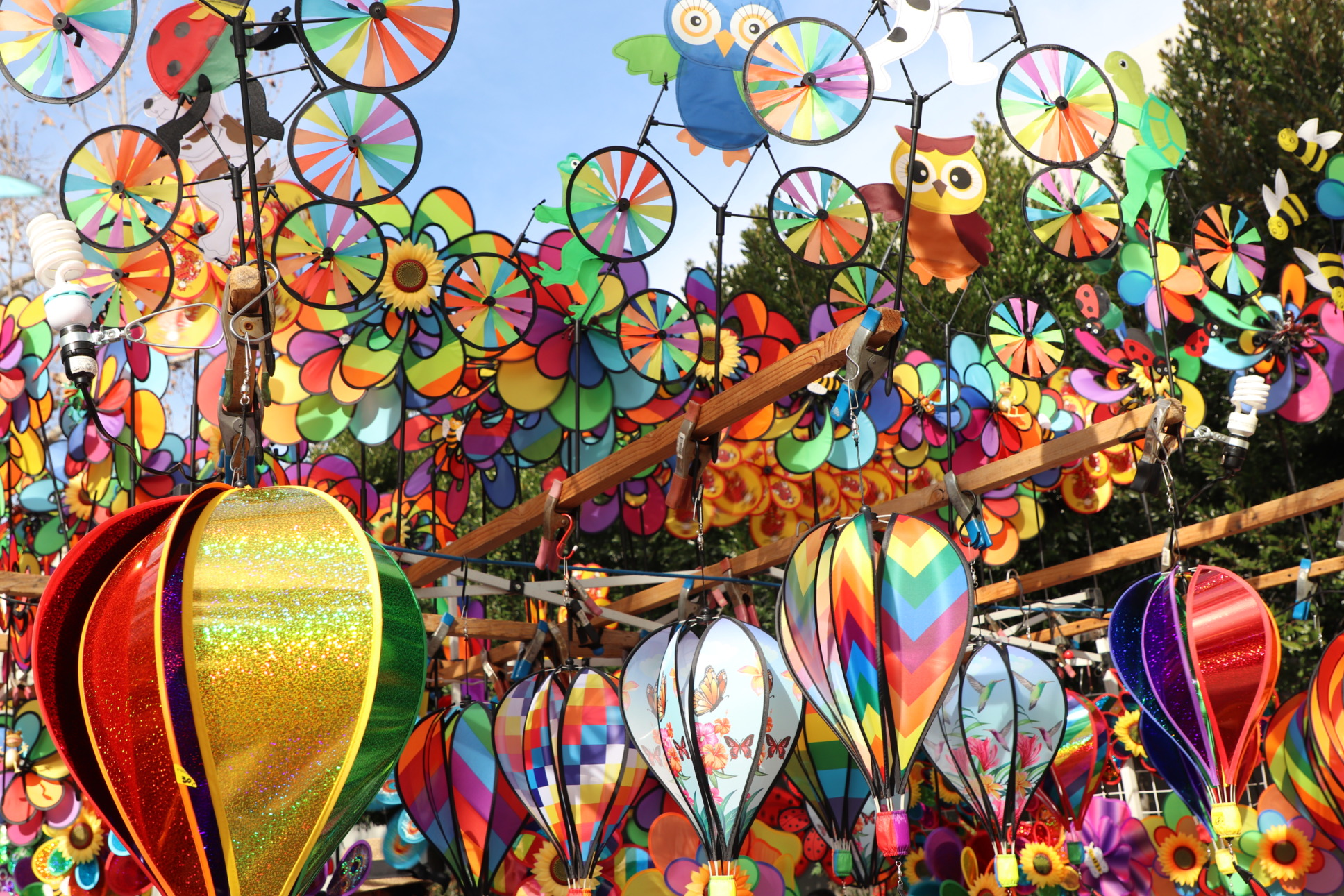 colorfull pinwheels, kites and chimes on display