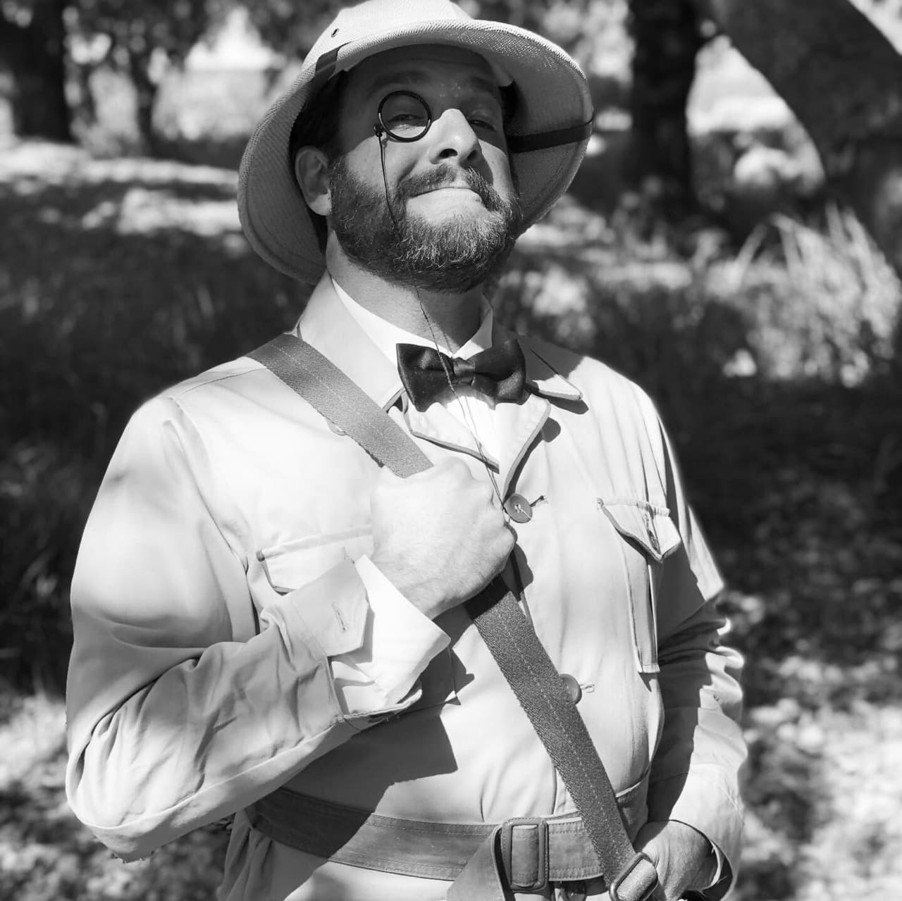 photo of Josh, Co-host of the Who New Podcast. he is wearing a jungle cruise costume. the photo is black and white, 