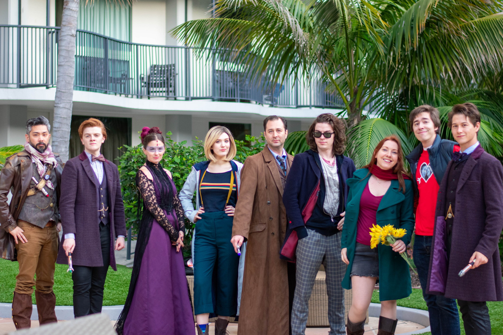 L-R: The War Doctor Cosplay (@whonewpodcast), Tasha Lem cosplay (Corissa B.), 13th Doctor Cosplay (@georgiiaagrace}, 10th Doctor cosplay (@doc_in_the_box), 12th Doctor Cosplay (@whocosplay), Amy Pond cosplay (@thegingercompanion), Rory Williams Cosplay (@vigilantecosplay), 11th Doctor Cosplay (@aaronrivin)