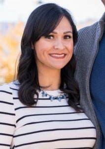 Photo of Lileana B. Roque, LCSW Clinical Therapist smiling and wearing a striped shirt. 