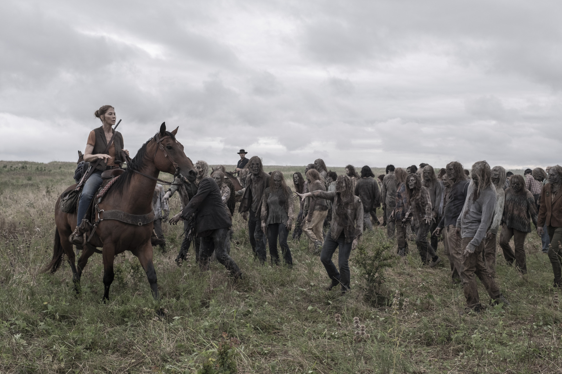 Jenna Elfman as June on Horseback as she is approached by a herd of Zombies