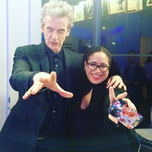 12th Doctor from Doctor Who (Peter Capaldi) with Dana posing for a photo. Peter Capaldi has his arm out in his iconic Doctor Who pose. 