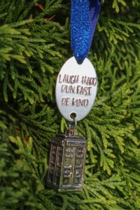 Christmas tree ornament with a 12th Doctor quote that says "Laugh hard. Run fast. Be kind."