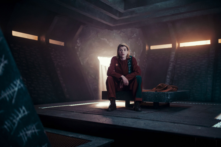 Jodie Whittaker as The Doctor sits in an alien jail cell during the Doctor Who Special 2020: Revolution Of The Daleks