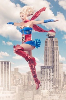 cosplay connection interview with candy keane, dressed as super girl posed with a city in the background