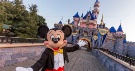 mickey mouse standing in front of the disneyland castle on a bridge, image used for this week in geek march 14th