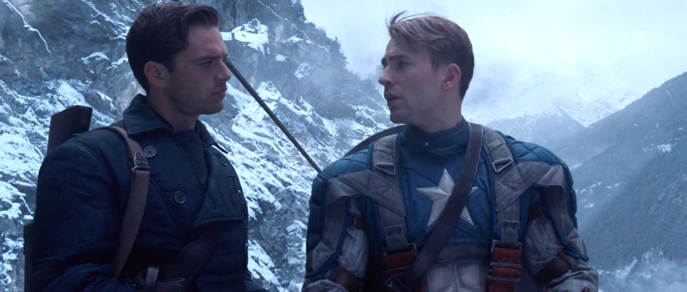 Falcon and the winter soldier recap: bucky and captain america stand on a train in front of a mountain