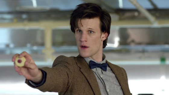 Matt Smith as The Doctor, holds out a jammie Dodger in front of him in in Doctor Who, Series 5 Episode 3, "Victory of the Daleks" 