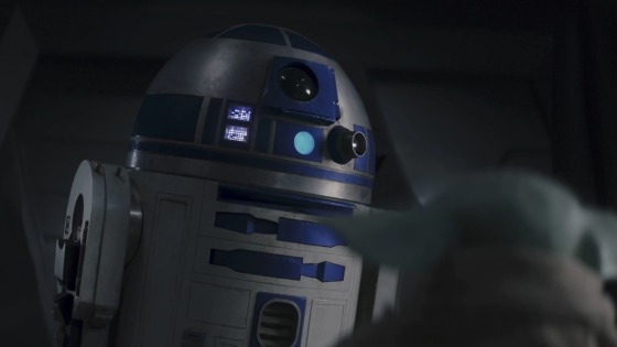 Droid R2-D2 looks down at Grogu in The Mandalorian