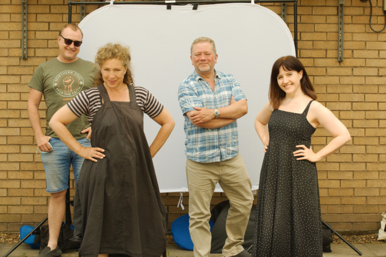 Tim Treloar (the 3rd Doctor), Alex Kingston (River Song), Jon Culshaw (the Brigadier), and Daisy Ashford (Dr. Liz Shaw) pose during the recording of "New Recruit"