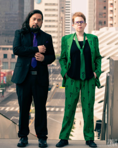 Two people model DC Comics Joker and Riddler suits from Fun.com. 