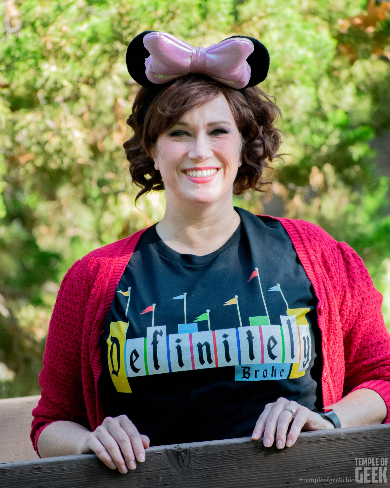 A model wears Minnie Mouse ears and a Disney tee.