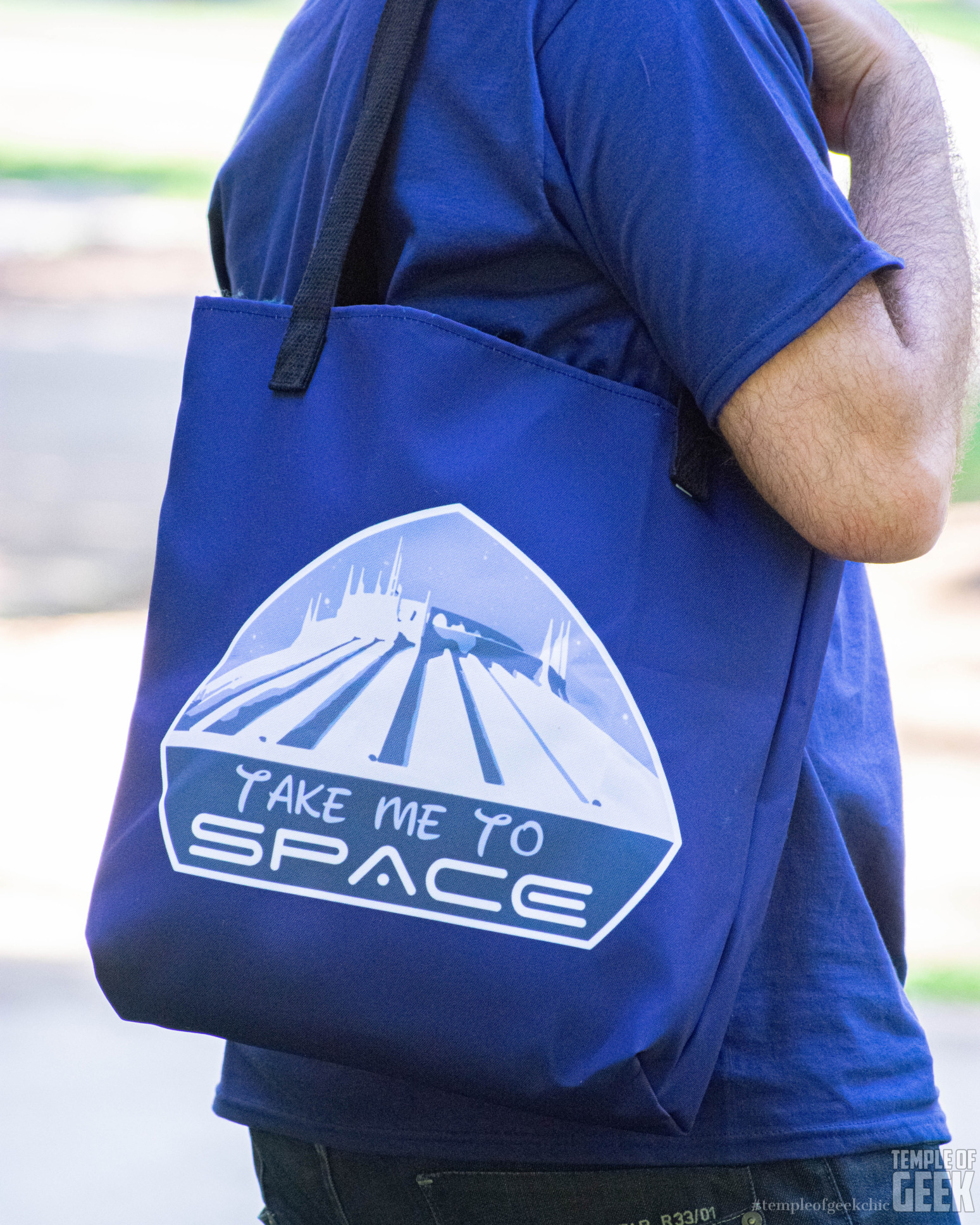 Closeup of a Disney-themed tote bag that reads "Take Me to Space."