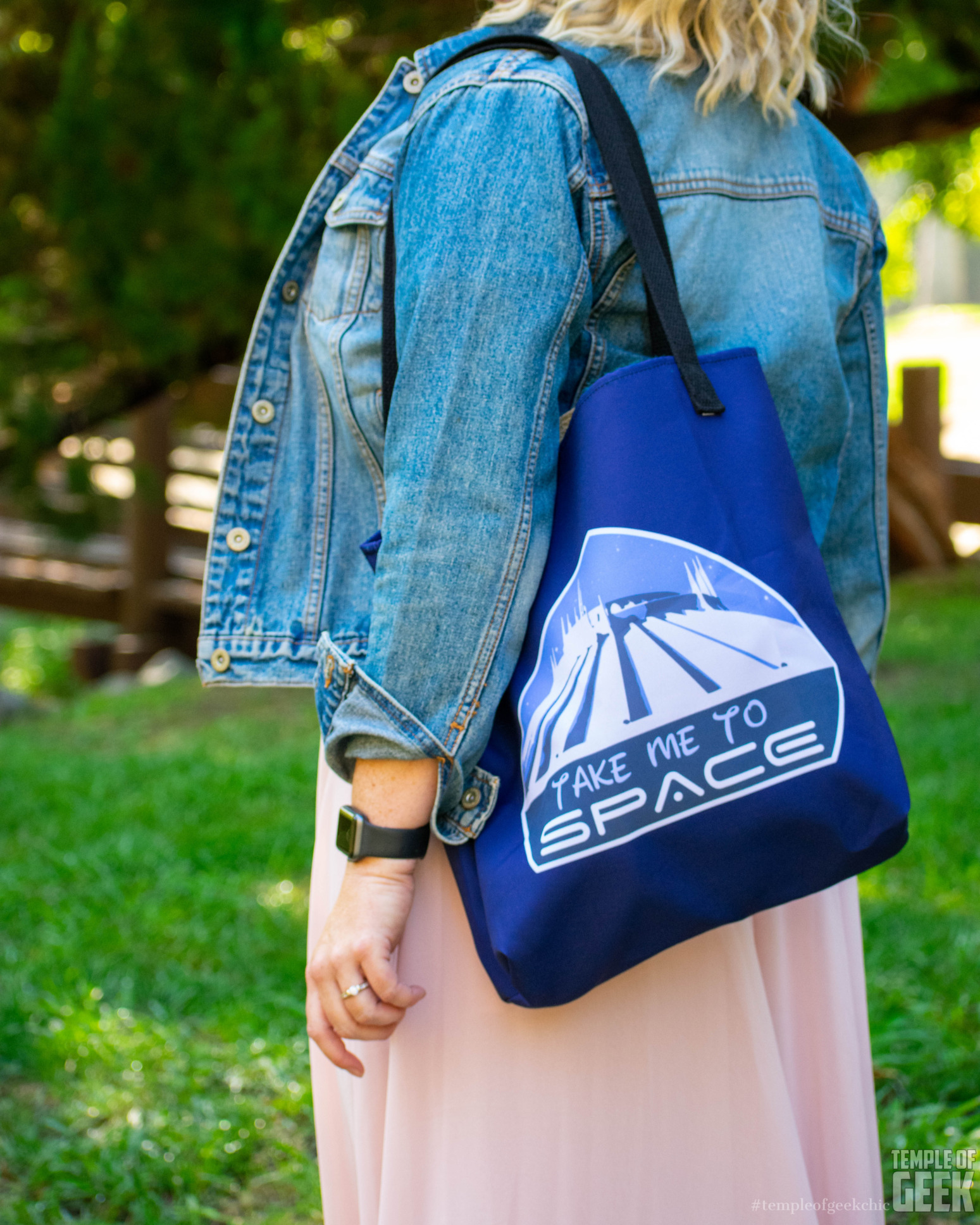 Closeup of a Disney-themed tote bag that reads "Take Me to Space."