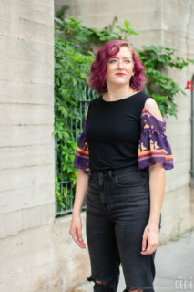 A model wears the Doctor Who inspired Ruffle Sleeve Top from Heroicouture. 