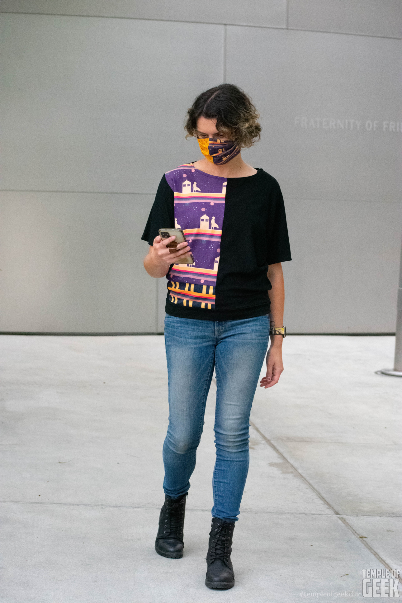 A model wears the Doctor Who themed Dolman top and a Doctor Who-themed mask from Heroicouture at Walt Disney Concert Hall.