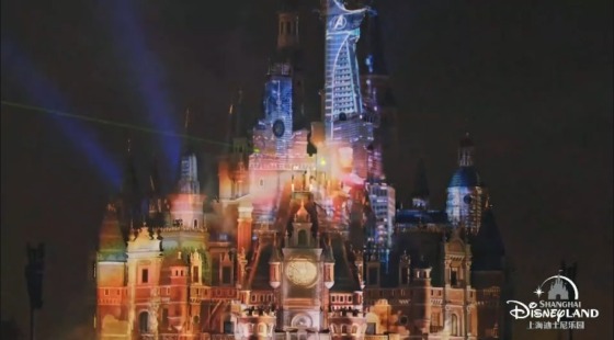 a shot of the castle at Shanghai Disneyland as the night time show Illuminate plays