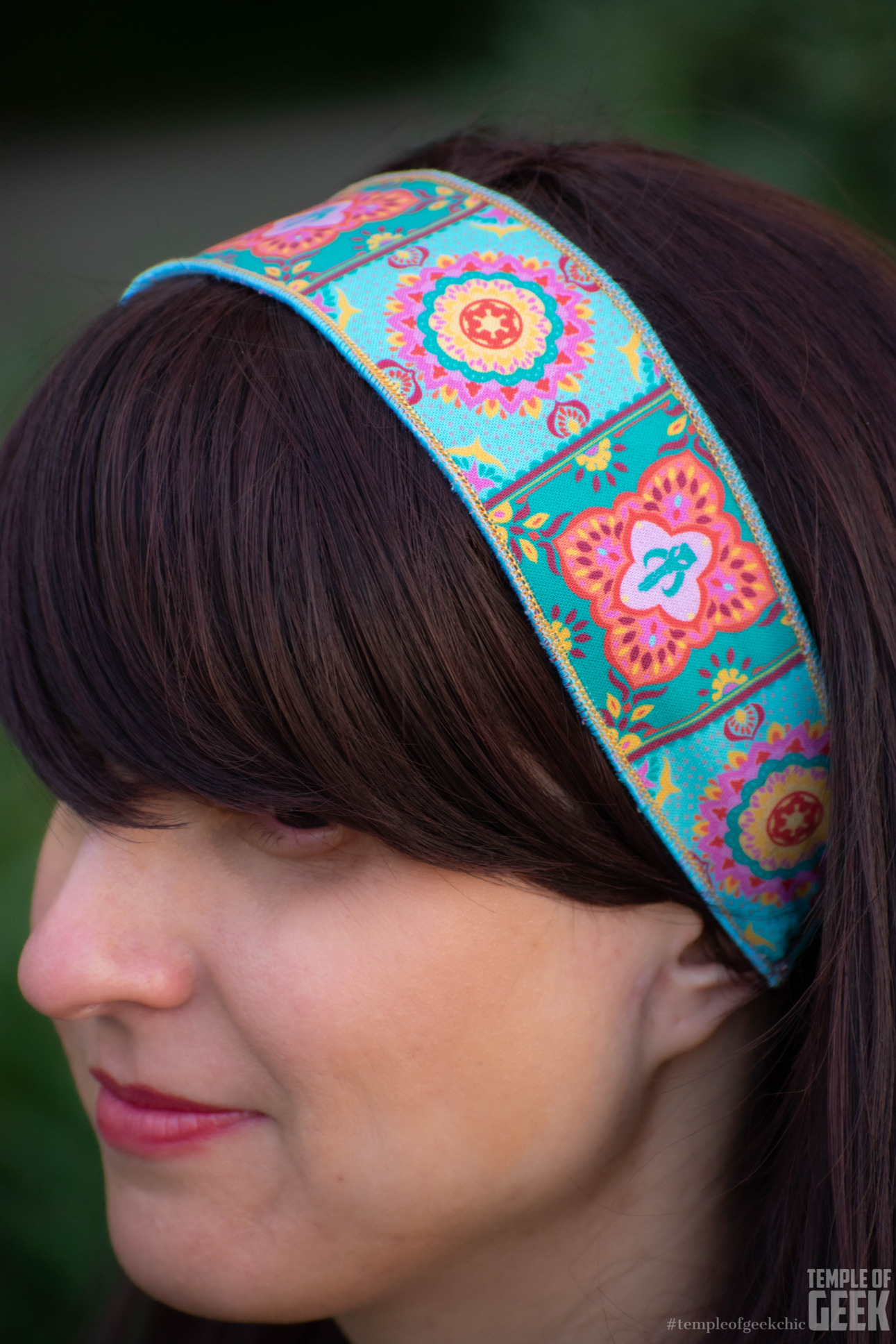 Closeup of a model wearing a Star Wars themed headband.