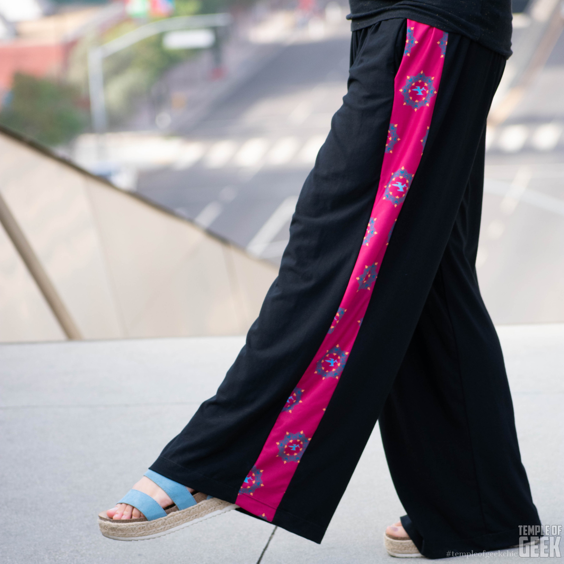 A closeup of Wonder Woman-themed palazzo pants by Heroicouture.