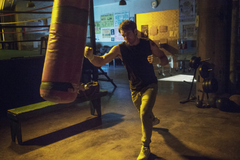 Charlie Cox as Matt Murdock punching a punching bag