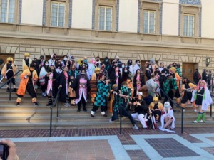 A large gathering of Demon Slayer cosplayers.