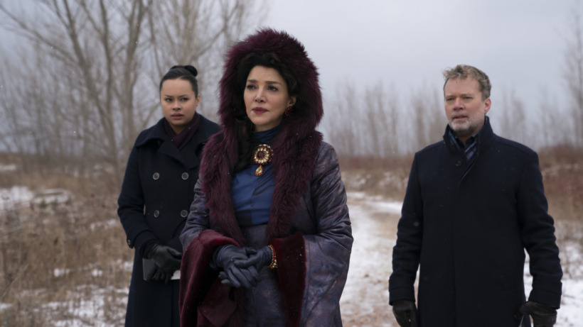 screen grab from season 6 of the expanse series. Frankie Adams (Roberta ‘Bobbie’ W. Draper), Shohreh Aghdashloo (Chrisjen Avasarala), Ted Dykstra (Gareth) are in the middle of the woods, dressed in warm clothing, examining something in the distance