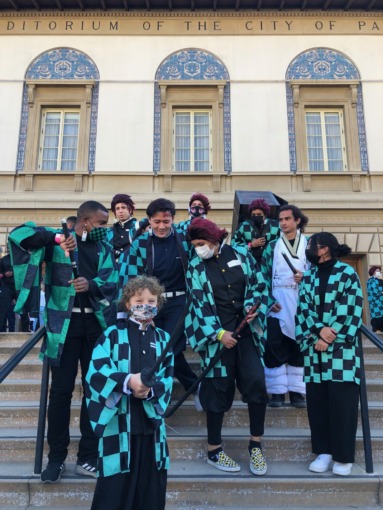 A group of Tanjiro cosplayers gather on the steps in front of the Pasadena Convention Center