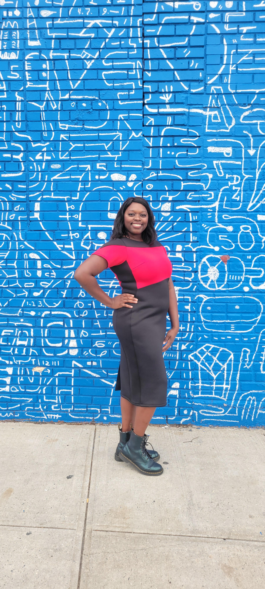 Arkeida Wilson models a dress she designed, inspired by the red uniforms in Star Trek.