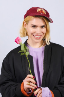 Billie Piper holding a rose, smiling, for Dimension Cannon