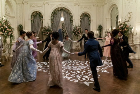 Second Season Bridgerton. (L to R) Shelley Conn as Mary Sharma, Ruth Gemmell as Lady Violet Bridgerton, Simone Ashley as Kate Sharma, Luke Newton as Colin Bridgerton, Charithra Chandran as Edwina Sharma, Claudia Jessie as Eloise Bridgerton, Luke Thompson as Benedict Bridgerton, Will Tilston as Gregory Bridgerton, Florence Emilia Hunt as Hyacinth Bridgerton, Adjoa Andoh as Lady Danbury, Jonathan Bailey as Anthony Bridgerton