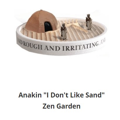 a sand zen garden with the "I don't like sand" quote printed around it with a Tusken Raider hut and two Tuskens