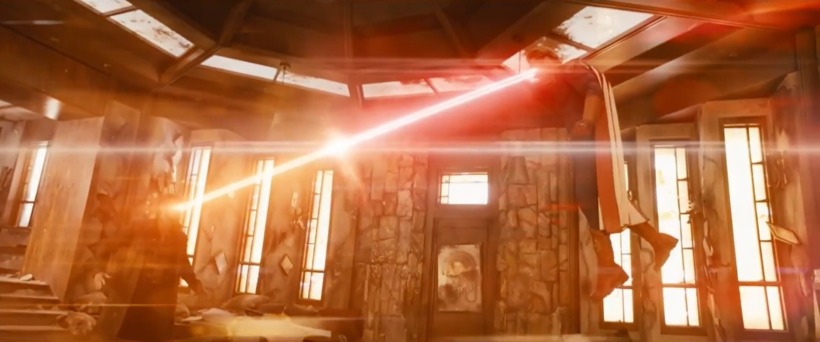 L-R Karl Urban as Butcher and Antony Starr as Homelander shoot lazers at one another. The lazer are coming out of their eyes as Homelander flies slightly above Butcher