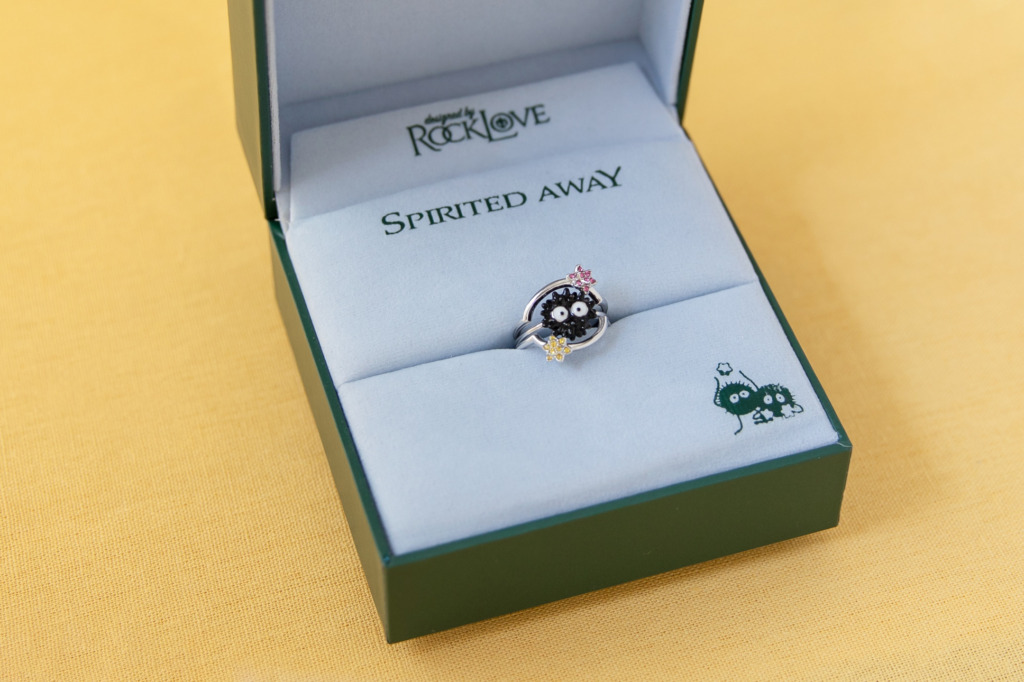 A Soot Sprite ring in a boutique jewelry box with the Spirited Away and RockLove logos. 