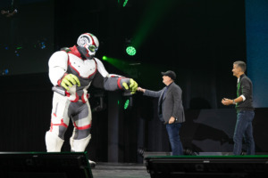 the Hulk shares a fist bump with Marvel's Kevin Feige at the D23 Expo Parks Panel