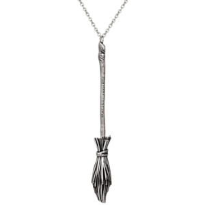 A sterling silver witch's broom pendant hangs from a chain, inspired by Hocus Pocus 2. 