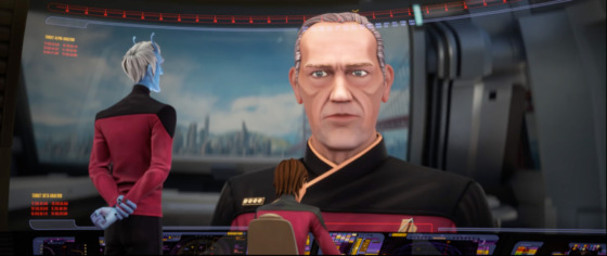 Shot of a Starfleet Andorian species looking on at the viewscreen inside a ship with Admiral Edward Jellico on the screen