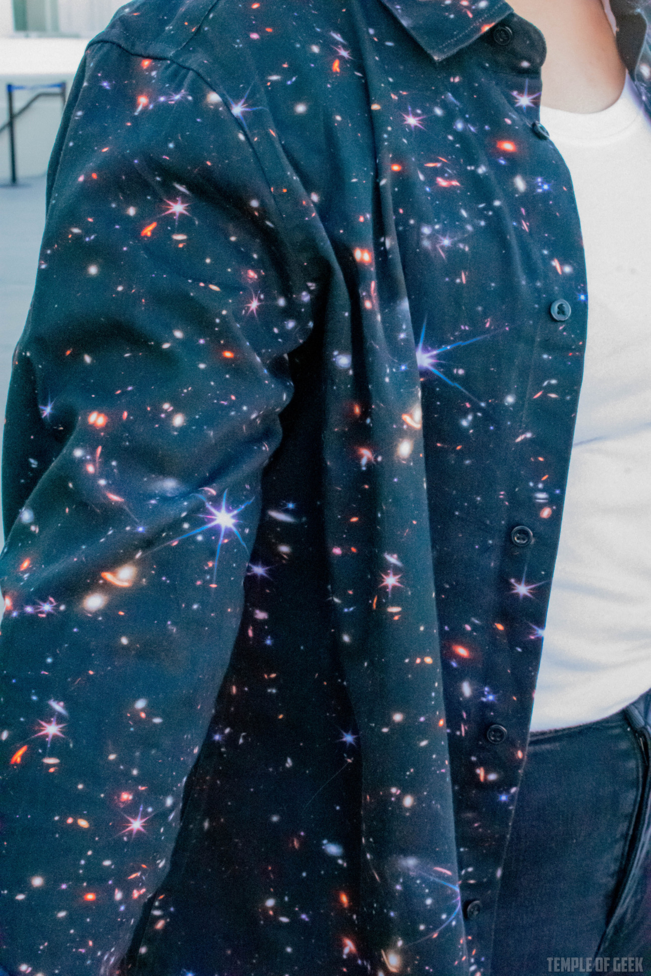 Closeup of a space-themed button-up shirt from Svaha.