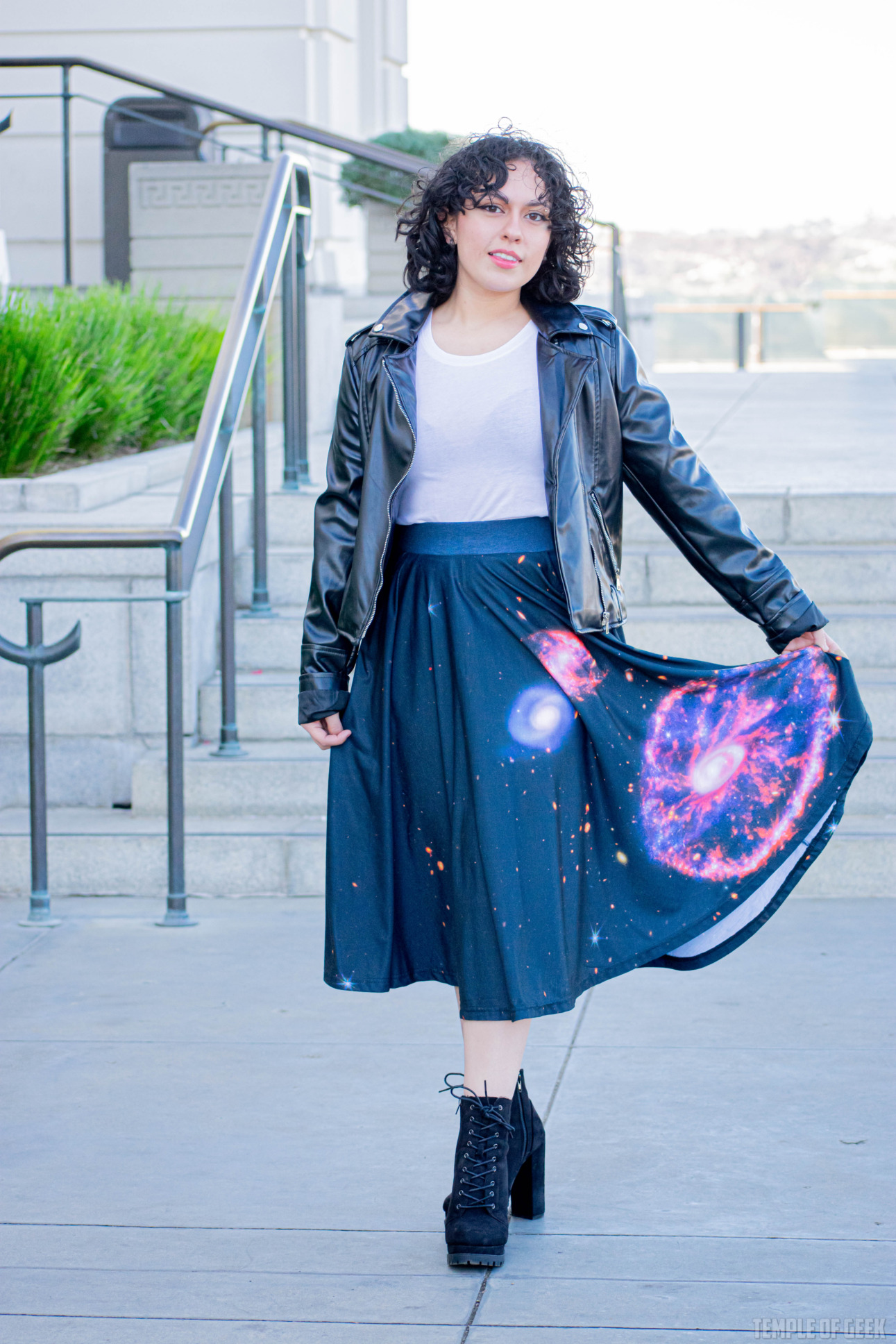 A model wears a leather jacket over a white tee with a twirl skirt from Svaha at Griffith Observatory.