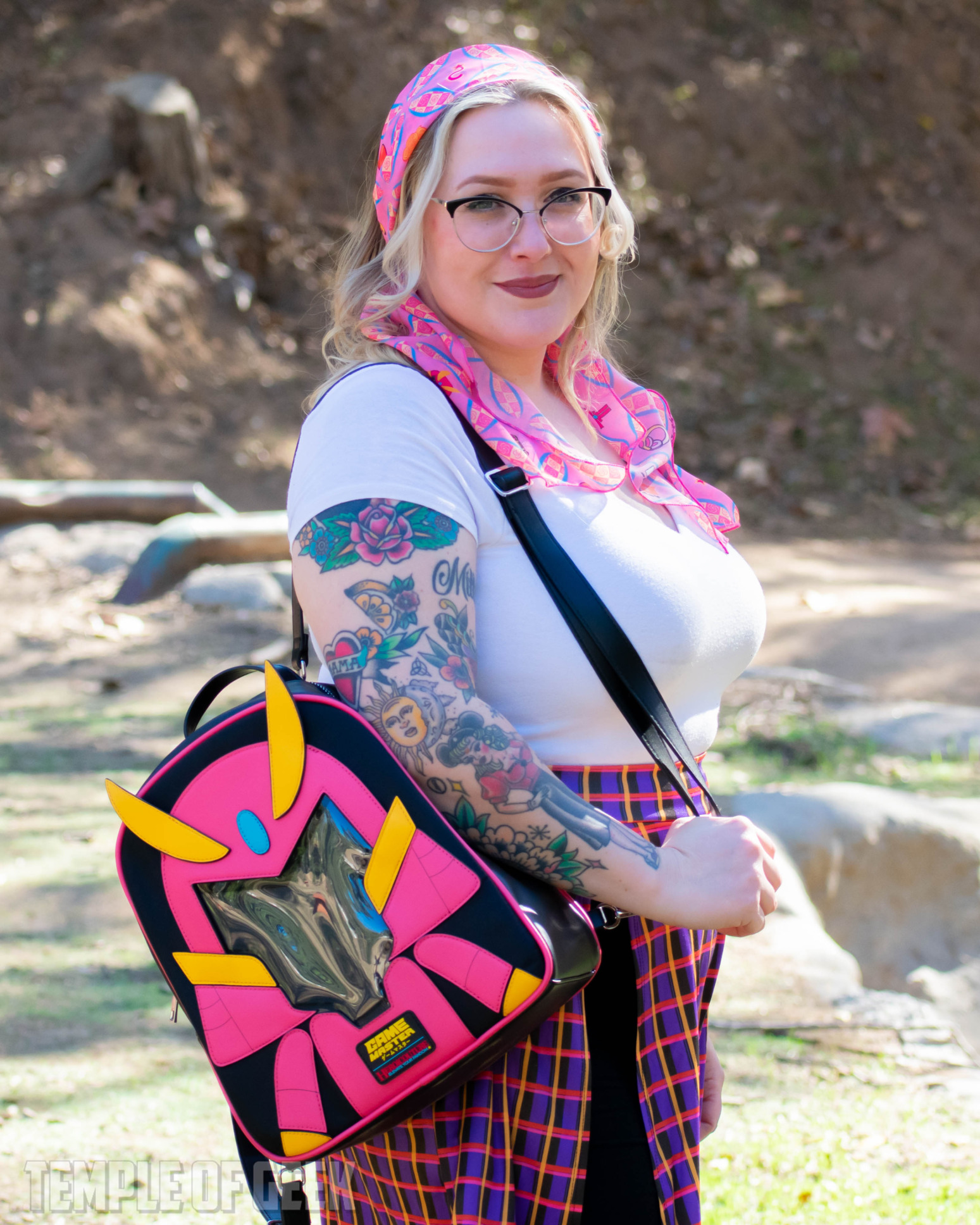 A model wears an ITA bag over her shoulder with the GameMaster mascot Hawk on the front.