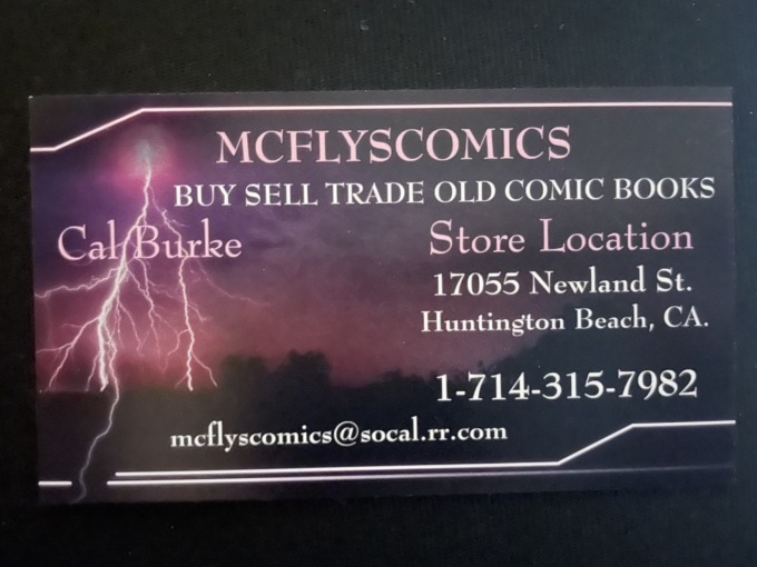 A business card advertises the comic book store McFlys Comics.