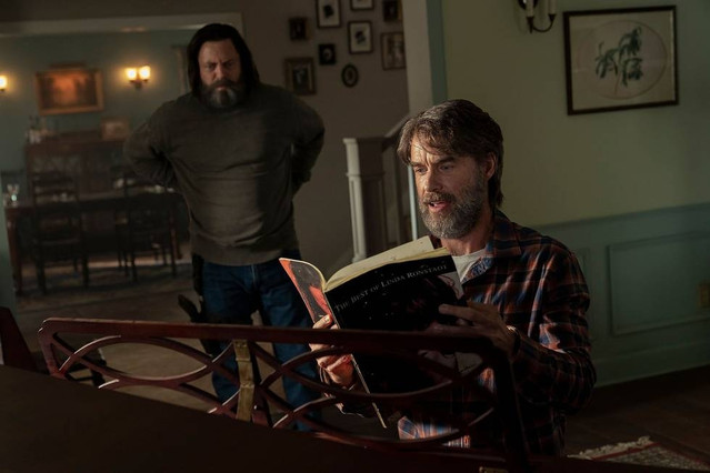 From left to right: Bill (Nick Offerman) stands and watches Frank (Murray Bartlett) at the piano in The Last of Us Episode Three (HBO).