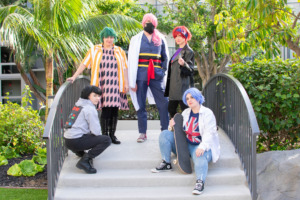 Sk8 the Infinity cosplay group posing on a small bridge at Gallifrey One