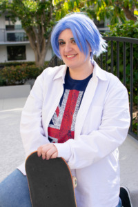 Sk8 the Infinity cosplay; cosplayer smiling and posing with a skateboard