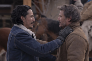 Tommy (Gabriel Luna) and Joel (Pedro Pascal) grasp each other's shoulders as they reunite