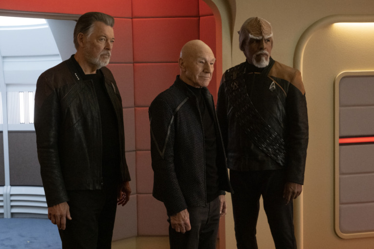 Jonathan Frakes as Will Riker, Patrick Stewart as Picard and Michael Dorn as Worf standing in front of an open Turbolift on the bridge of the U.S.S. Enterprise-D in"The Last Generation" Episode 310, Star Trek: Picard