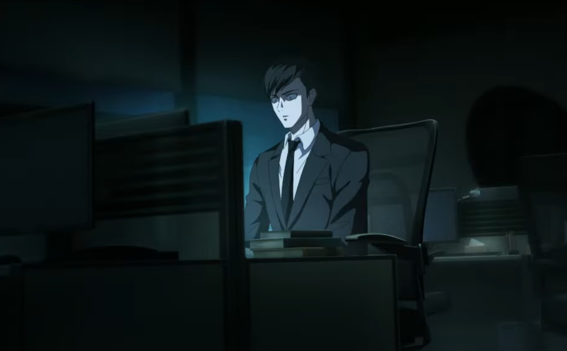 X&Y Yan sits at his desk in the dark